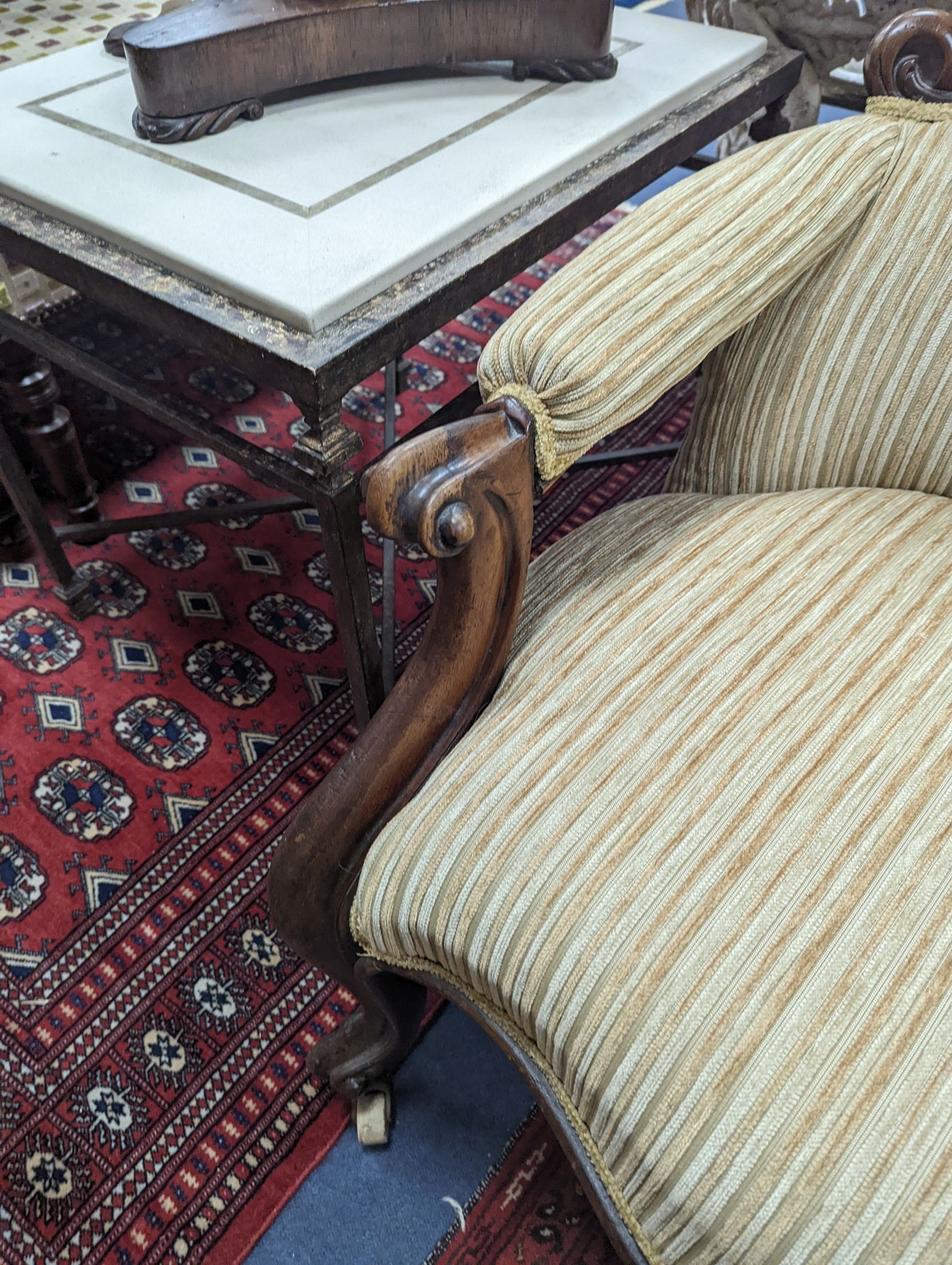 A Victorian upholstered spoon back armchair, width 71cm, depth 74cm, height 102cm